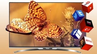 Finlux 55F9076-T television displaying a butterfly image with app icons.