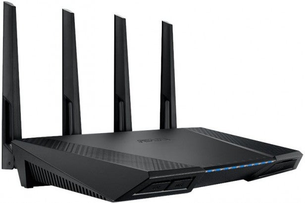 Black wireless router with four antennas and LED indicators.