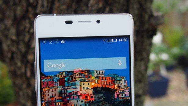 Smartphone on display with colorful wallpaper.