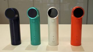 HTC RE cameras in different colors displayed on table.