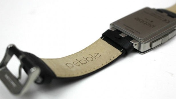 Close-up of a Pebble Steel smartwatch with leather strap.