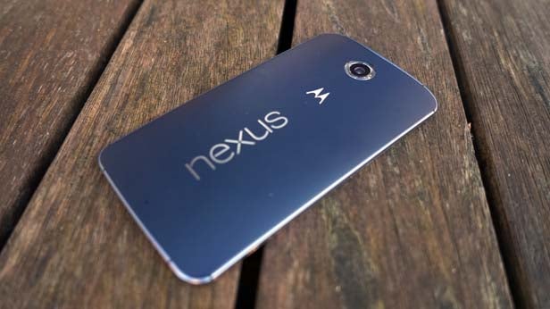 Nexus 6 smartphone lying on a wooden surface.