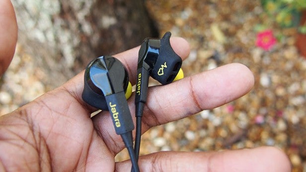 Jabra Sport Pulse Wireless earbuds held in a hand.
