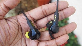 Jabra Sport Pulse Wireless earbuds held in a person's palm.