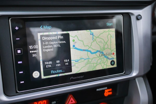 Apple CarPlay screen displaying map navigation in a car.