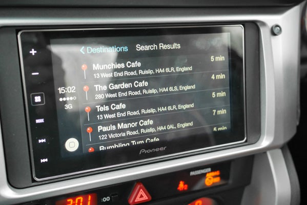 CarPlay interface on Pioneer display showing navigation search results.