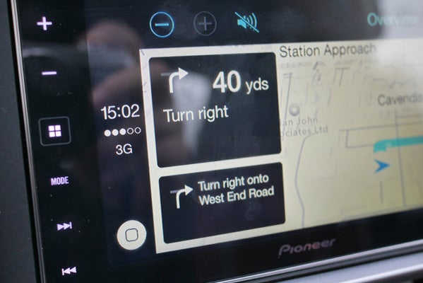 CarPlay navigation screen displaying turn-by-turn directions.