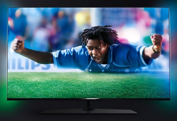 Philips 42PUS7809Man celebrating on a high-definition TV screen displaying vibrant colors.