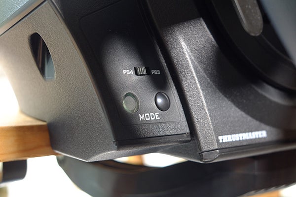Close-up of Thrustmaster T300 GTE wheel's mode switch.