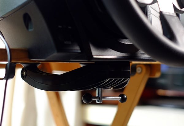 Close-up of Thrustmaster T300 GTE wheel mounted on a stand.