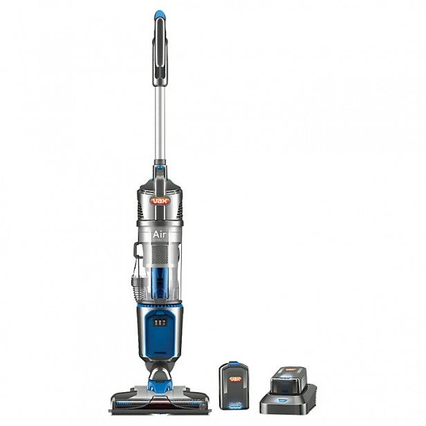 Upright vacuum cleaner with accessories for pet hair removal.