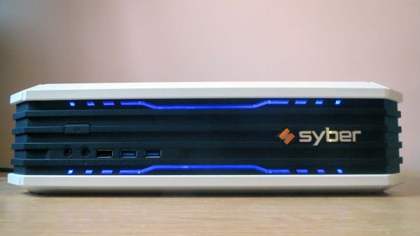 Syber Vapor I gaming console with blue LED lights on desk.