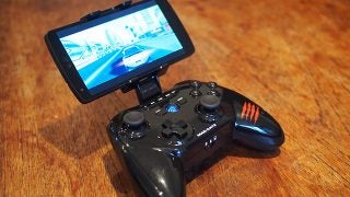 Mad Catz C.T.R.L.R game controller with attached smartphone displaying game.