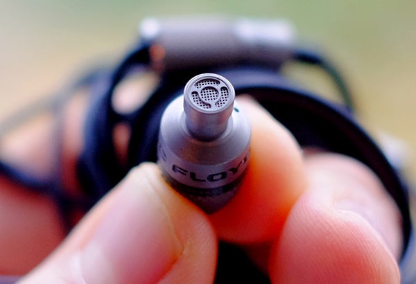 Close-up of Atomic Floyd SuperDarts Titanium earphone.