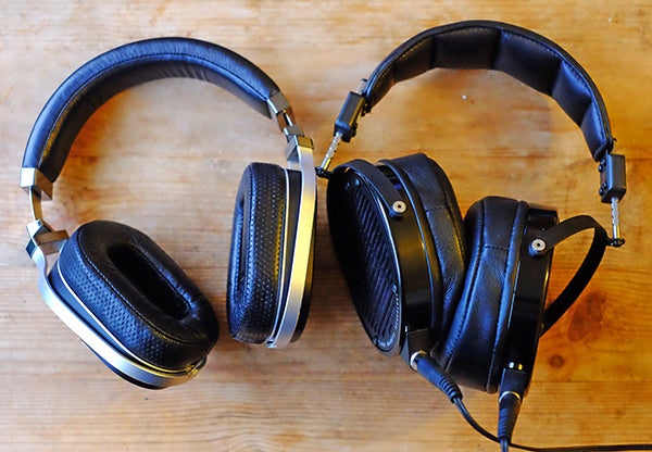 Audeze LCD-X over-ear headphones on wooden surface.