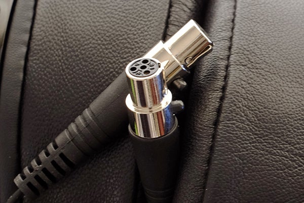 Audeze LCD-X headphone connectors on leather surface