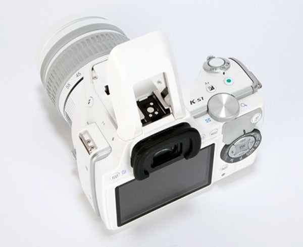 Pentax K-S1 DSLR camera with white lens mounted