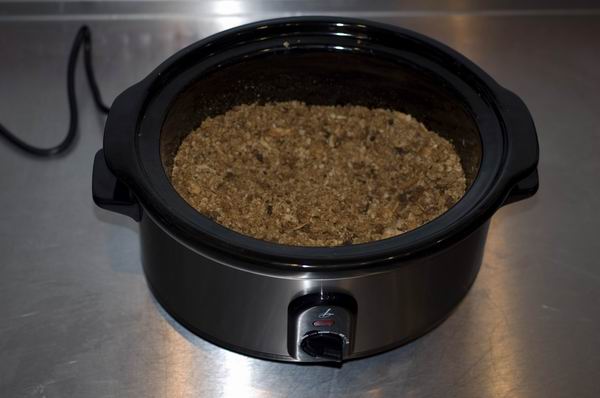 Lakeland slow cooker with food on kitchen counter.
