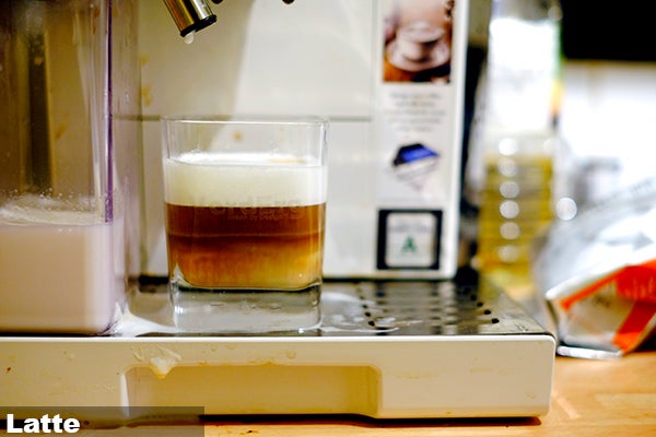 DeLonghi Eletta machine preparing a latte.