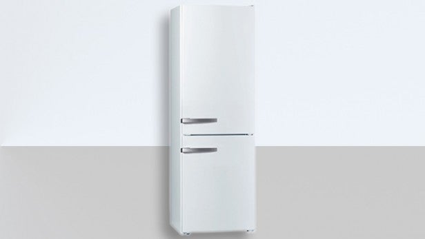 White refrigerator against a grey background for product review.