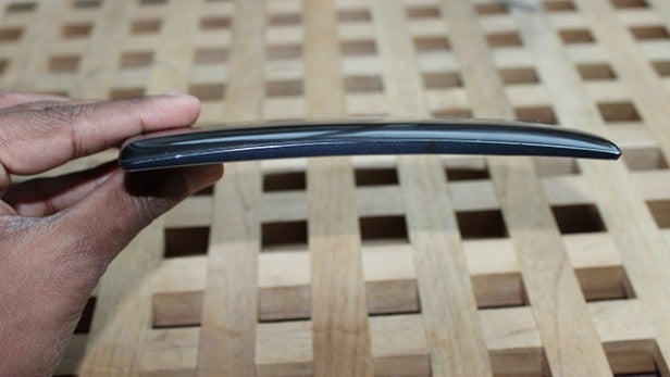 Hand holding LG G Flex 2 to show curved design