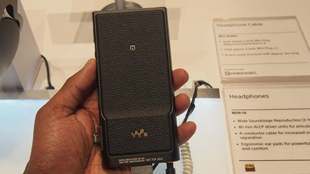 Hand holding the Sony NWZ-ZX2 Walkman on display.Hand holding a Sony NWZ-ZX2 Walkman on display