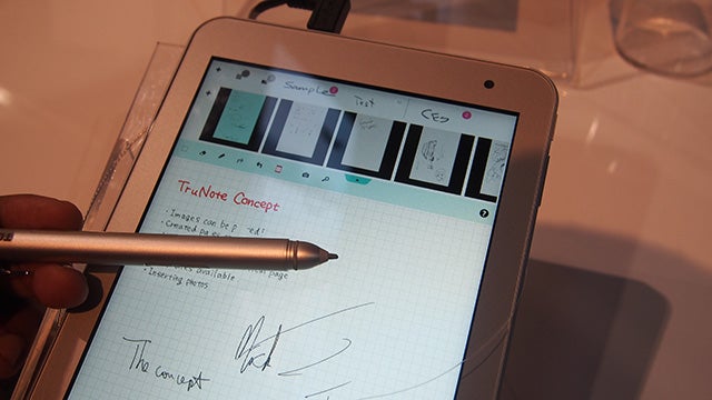 Hand using stylus on Toshiba Encore 2 Write tablet.