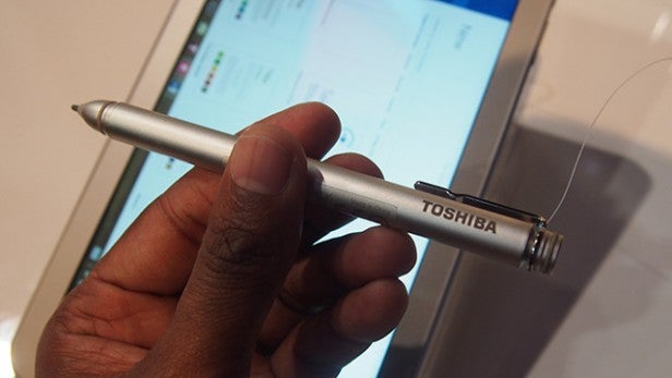 Hand holding Toshiba Encore 2 Write stylus with tablet background.Hand holding Toshiba Encore 2 Write stylus with screen background.