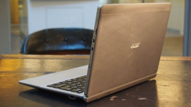 Acer Aspire Switch 11 laptop on a wooden table.