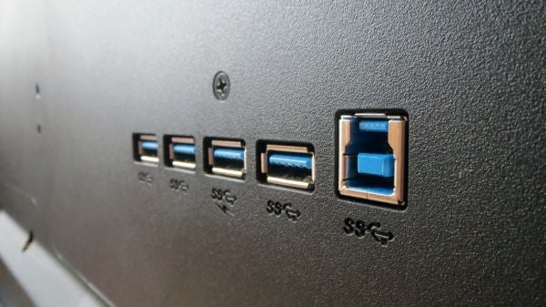 Close-up of Philips monitor ports including USB and DisplayPort inputs.