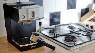 Krups XP5620 espresso machine on a kitchen counter.