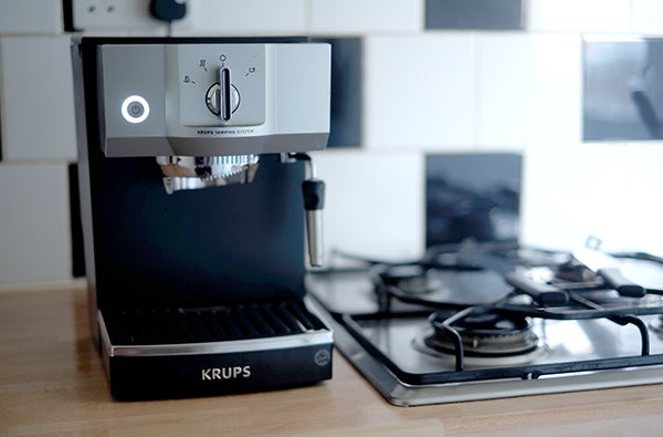 Krups XP5620 espresso machine on kitchen counter.