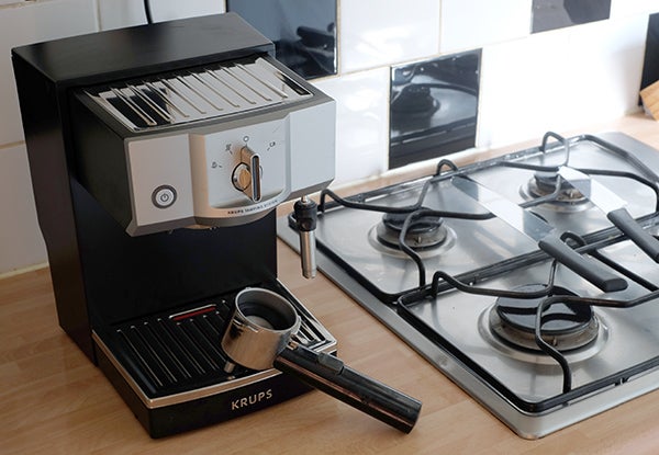 Krups XP5620 espresso machine on kitchen countertop.