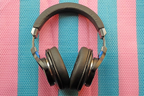 Audio-Technica ATH-MSR7 headphones on pink and blue background.