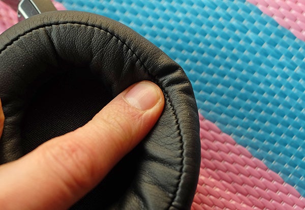 Close-up of a finger pressing Audio-Technica earpad cushion.