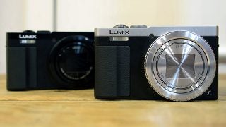 Panasonic Lumix TZ70 cameras on wooden surface.