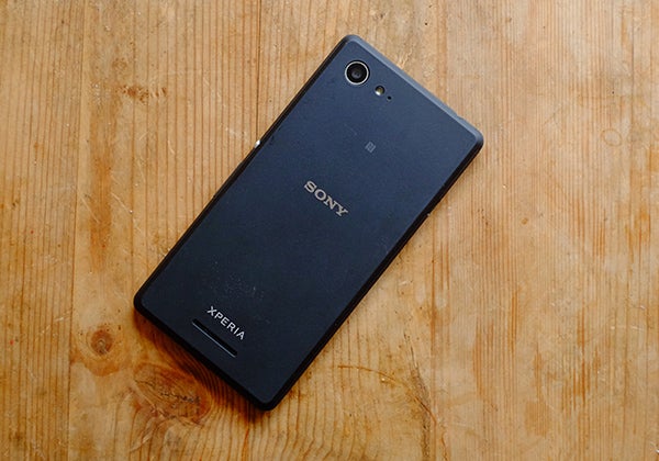 Sony Xperia E3 smartphone on a wooden surface.