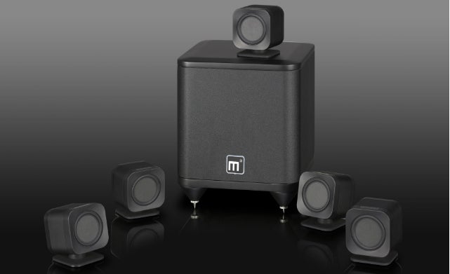 Mission M3 surround sound speaker system on black background.