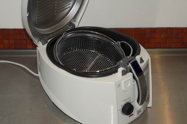 DeLonghi RotoFry F28311 deep fryer with open lid on kitchen counter.