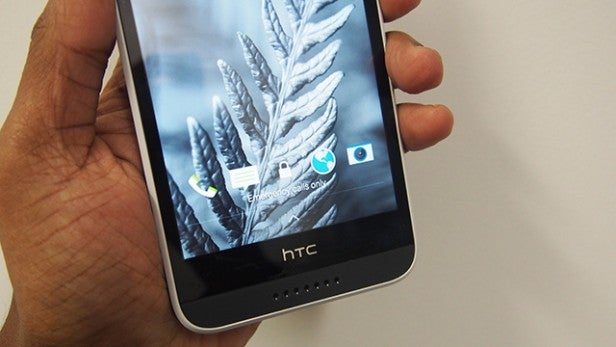 Hand holding HTC Desire 620 smartphone with screen onHand holding an HTC Desire 620 smartphone