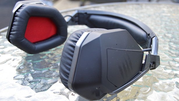 Mad Catz F.R.E.Q 9 wireless gaming headset on glass table.