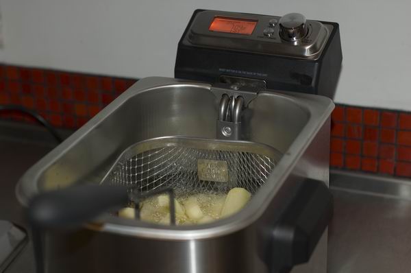 Sage Smart Fryer with fries cooking and digital display.