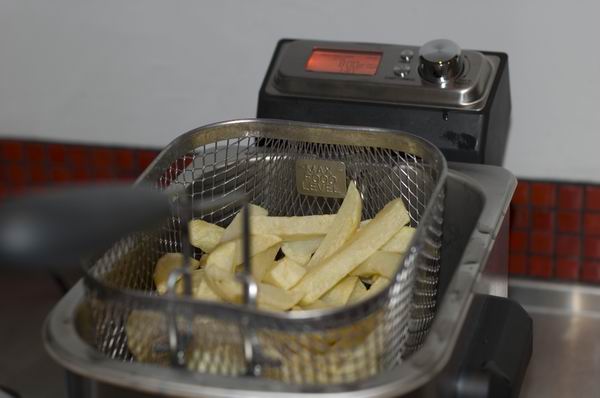 Sage Smart Fryer with raw fries ready for cooking.