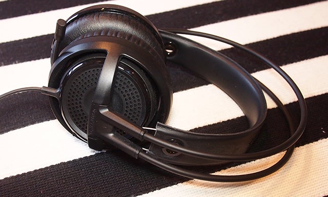 SteelSeries Siberia V3 headphones on striped background.