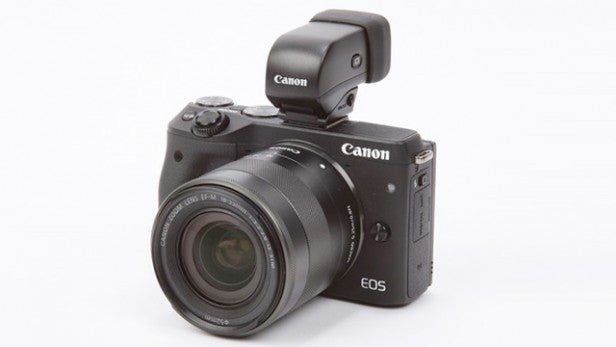 Canon EOS M3 camera with external electronic viewfinder attached.