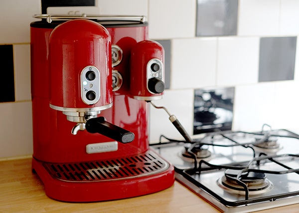 Red KitchenAid Artisan Espresso Machine on kitchen counter.