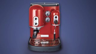 Red KitchenAid Artisan Espresso Machine on blue background.