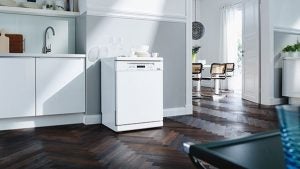 Miele G6410SC dishwasher in a modern kitchen setting.