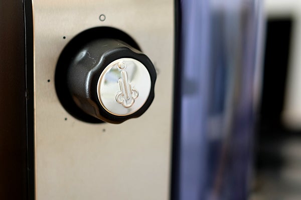Close-up of Morphy Richards espresso machine power button.