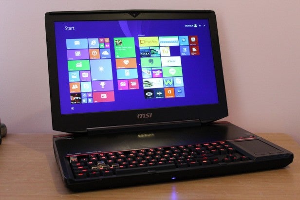 MSI laptop with backlit keyboard and trackpad on desk.